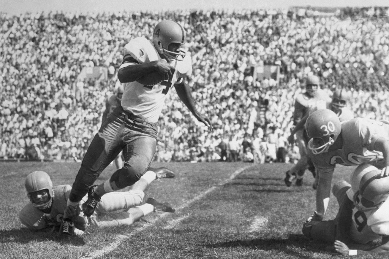 Football Player Escaping Tackle